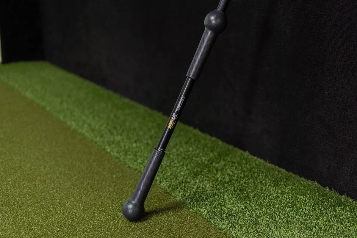 BendyBar in use: Controlled rotational work for golfers and rotational-sport athletes.